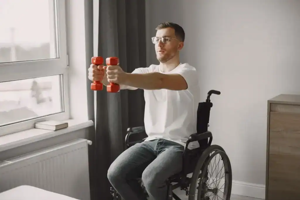 Image of man doing exercise in his wheelchair to aid weight loss Cirencester