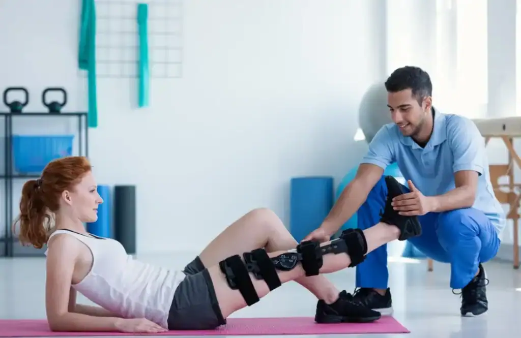 Woman having treatment to help muscle recovery Cirencester after an injury